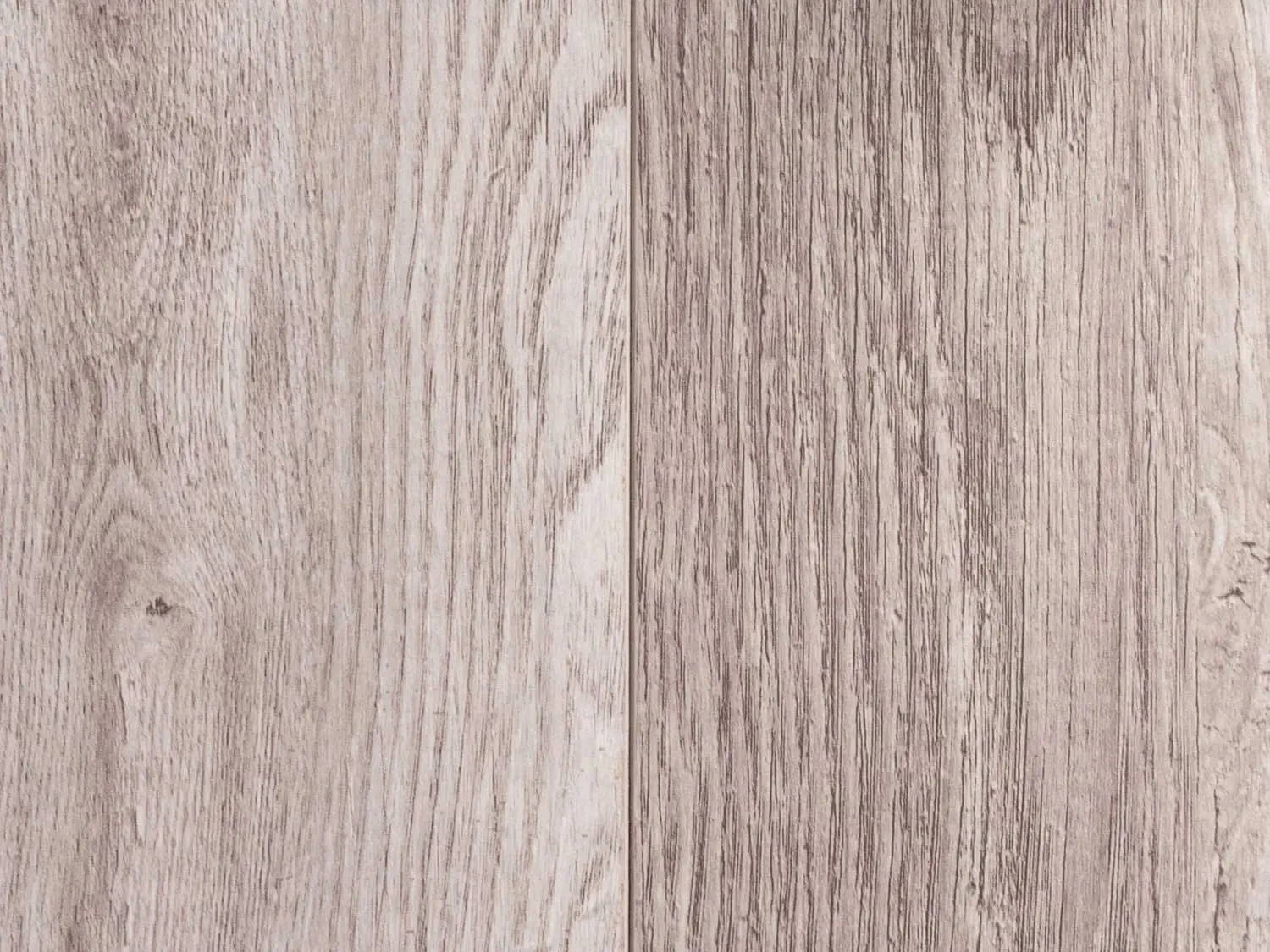 Close up of grey wood effect laminate floor.