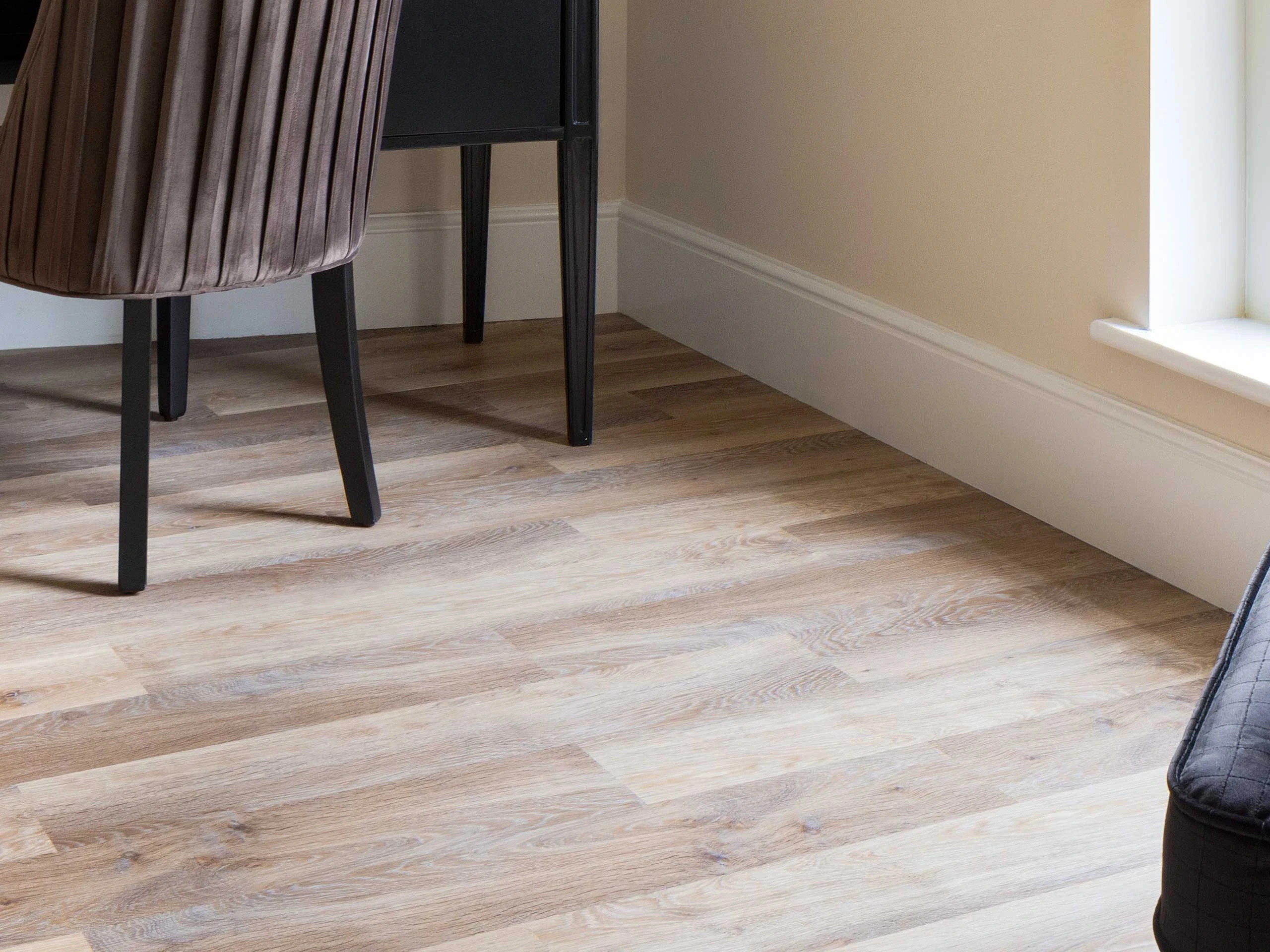 Wood effect luxury vinyl tile in home office space.