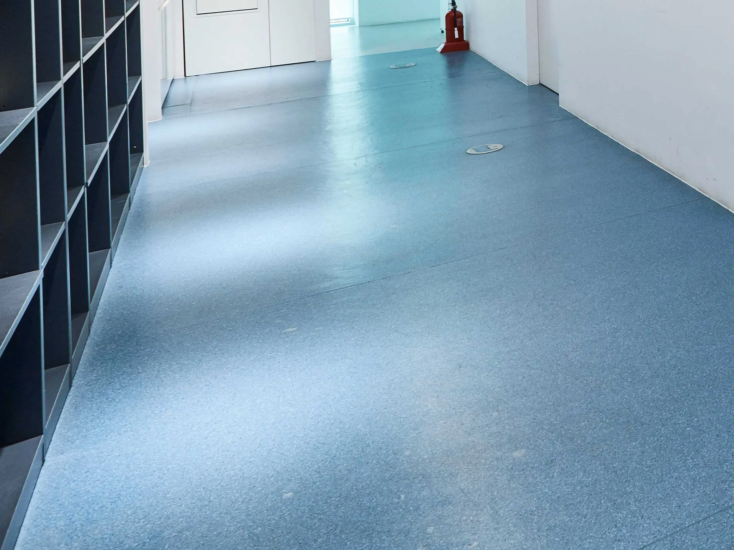 Safety vinyl flooring in empty corridor.