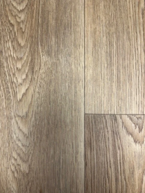 Close up of vinyl tile effect sample in a wood style.