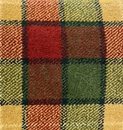 Close up of a tarten carpet sample with reds greens and yellows.