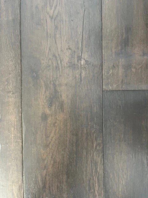 Close up of an aged wood sample of laminate flooring.